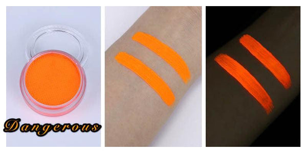 Neon orange UV face and body paint in a pot with skin swatches shown in daylight and glowing under blacklight.