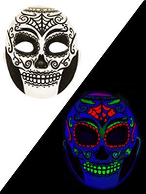 Sugar skull mask showing black patterns in daylight and glowing neon colors under UV black light.