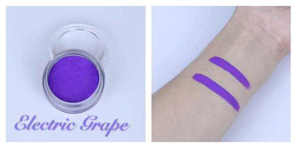 Electric Grape neon purple UV reactive face and body paint in a jar with two vibrant swatches on a wrist.