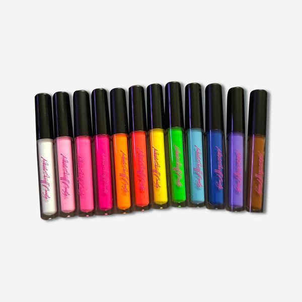 Twelve vibrant Ashunta Sheriff Beauty UV vegan paint liners in clear tubes with black caps arranged in a row.